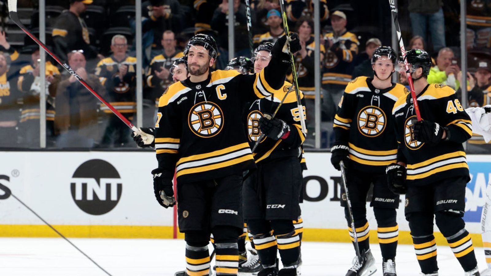 Brad Marchand and Patrice Bergeron share a moment at Charlie