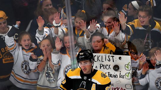 How a chat with Ray Bourque inspired a memorable interaction between Brad Marchand and a young fan taken at BSJ Headquarters (Bruins)