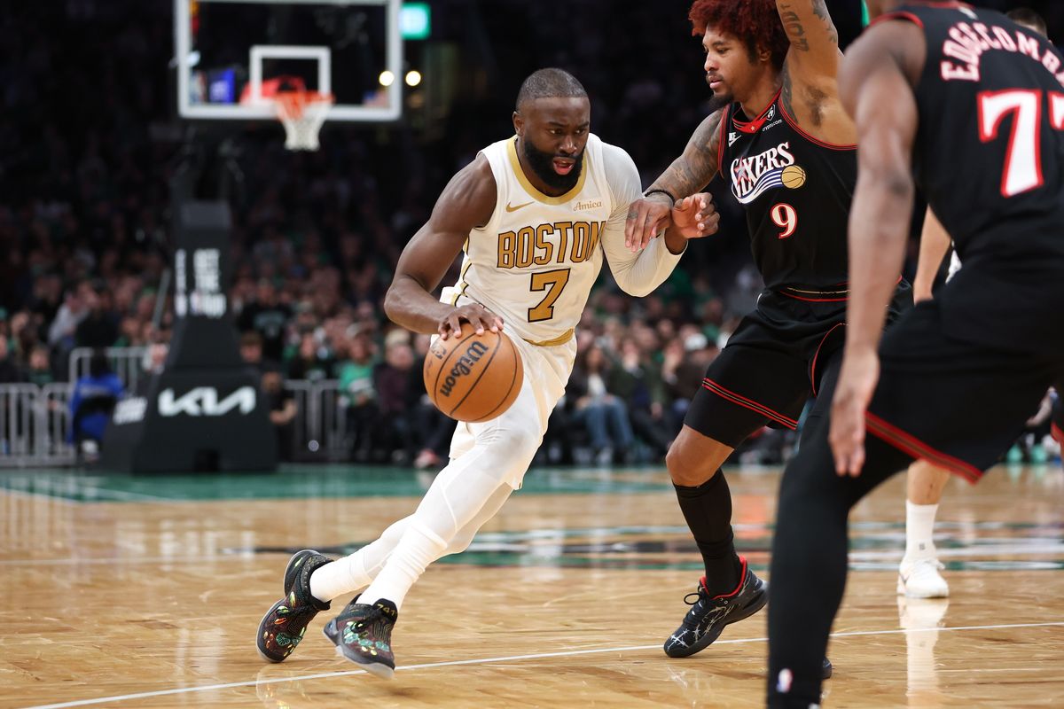 Jaylen Brown drives on Kelly Oubre Jr.