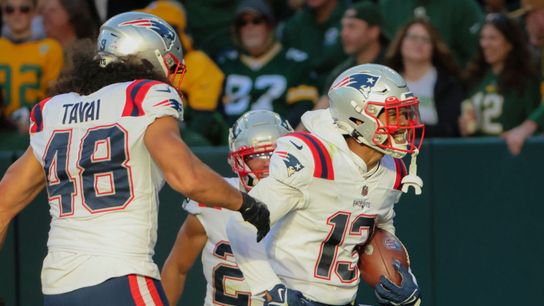 Green Bay, WI - October 2: New England Patriots CB Jack Jones celebrates his interception for a touchdown. The Patriots lost to the Green Bay Packers, 27-24, in overtime. Green Bay, WI - October 2: New England Patriots CB Jack Jones celebrates his interception for a touchdown. The Patriots lost to the Green Bay Packers, 27-24, in overtime.