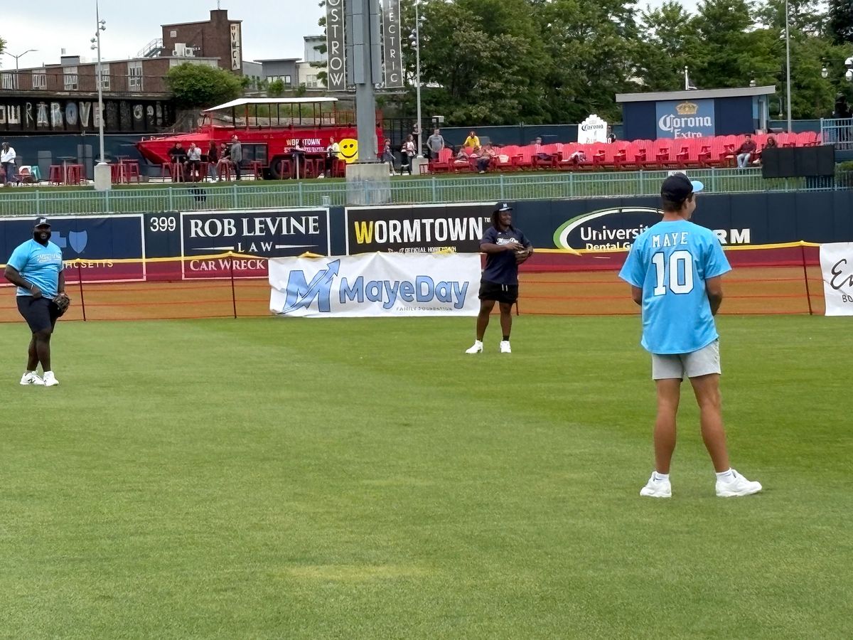 Maye gets loose with Mike Onwenu (left) and Jared Wilson. 