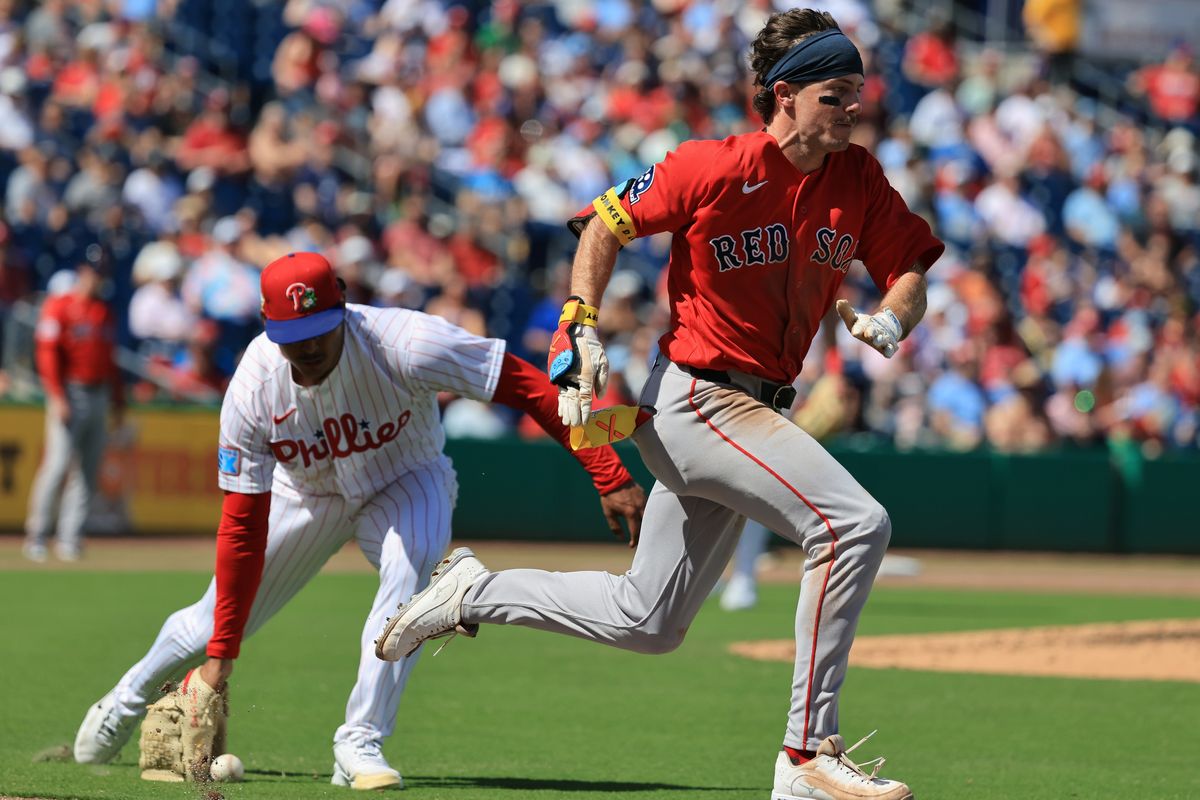 Mar 5, 2026; Clearwater, Florida, USA; Boston Red Sox outfielder Braiden Ward (92) bunts for a single against the Philadelphia Phillies at BayCare Ballpark. Mar 5, 2026; Clearwater, Florida, USA; Boston Red Sox outfielder Braiden Ward (92) bunts for a single against the Philadelphia Phillies at BayCare Ballpark.