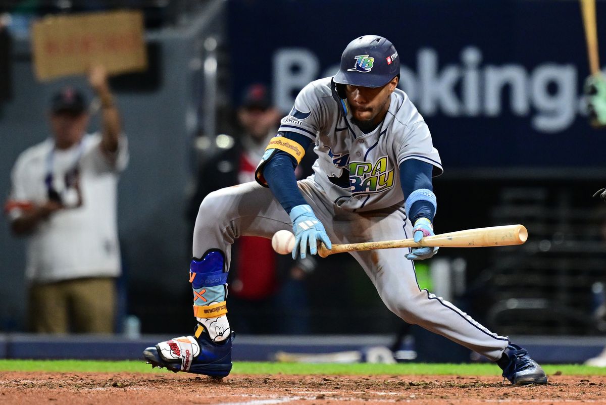 Oct 18, 2026; Cleveland, Ohio, USA; Tampa Bay Rays outfielder Chandler Simpson (14) hits a sacrifice bunt during the eighth inning against the Cleveland Guardians at Progressive Field. Oct 18, 2026; Cleveland, Ohio, USA; Tampa Bay Rays outfielder Chandler Simpson (14) hits a sacrifice bunt during the eighth inning against the Cleveland Guardians at Progressive Field.