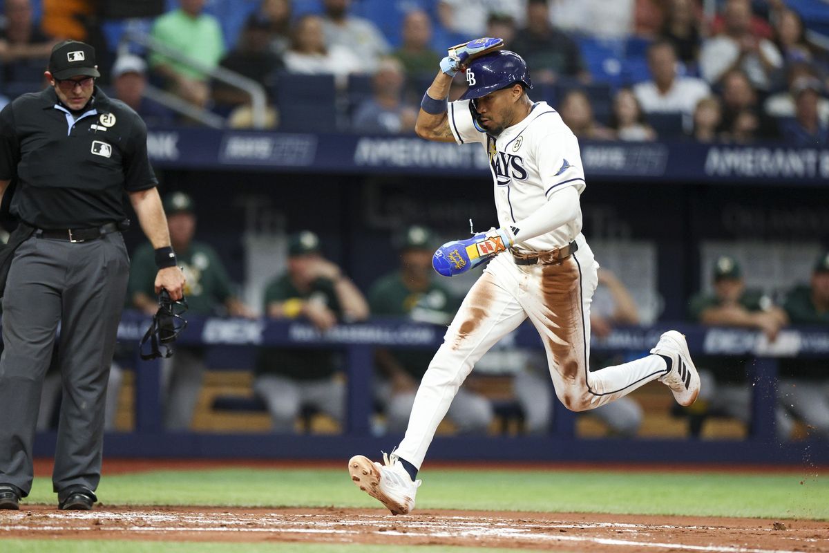 Sep 15, 2026; St. Petersburg, Florida, USA; Tampa Bay Rays left fielder Chandler Simpson (14) scores a run against the Oakland Athletics in the second inning at Tropicana Field. 