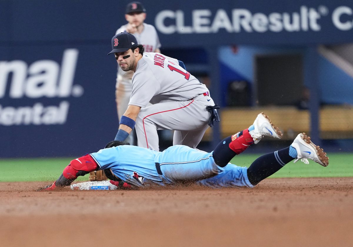 Apr 28, 2026; Toronto, Ontario, CAN; Toronto Blue Jays third baseman Kazuma Okamoto (7) is tagged out at second base by Boston Red Sox second baseman Marcelo Mayer (11) during the third inning at Rogers Centre.