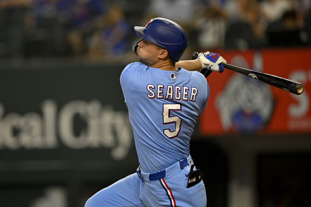 Sep 6, 2026; Arlington, Texas, USA; Texas Rangers shortstop Corey Seager (5) hits a home run during the game between the Rangers and the Rays at Globe Life Field. Sep 6, 2026; Arlington, Texas, USA; Texas Rangers shortstop Corey Seager (5) hits a home run during the game between the Rangers and the Rays at Globe Life Field.