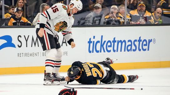 Six months removed from shoulder surgery, John Moore put plenty at risk to stand up for a teammate taken at TD Garden (Bruins)